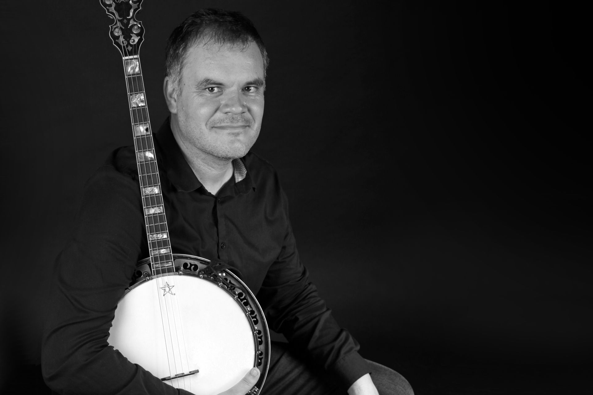 Photo d'Olivier Sulpice avec son banjo